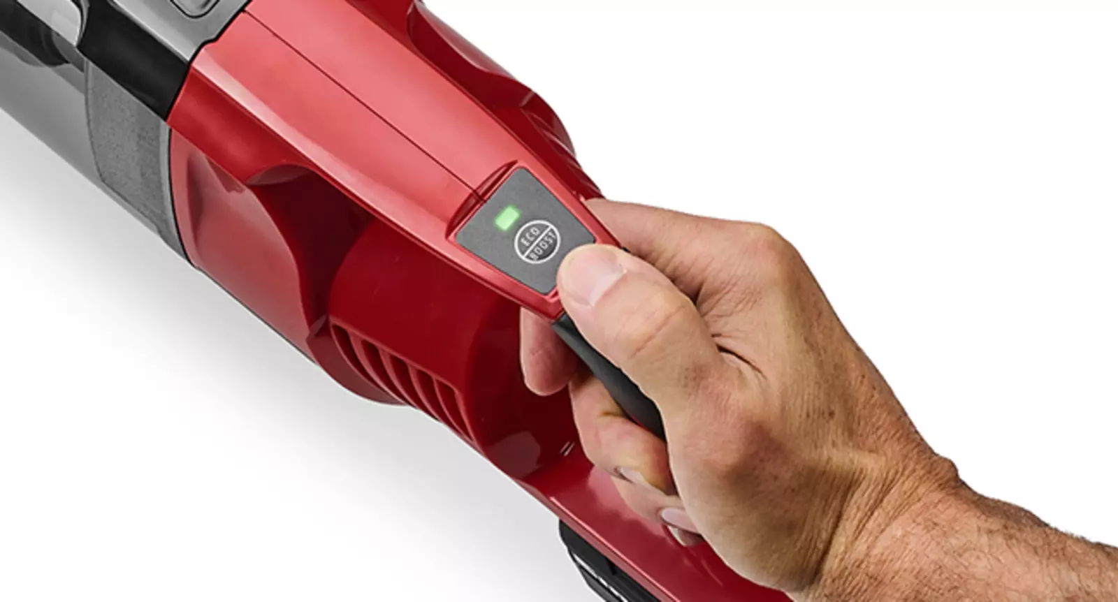 Close-up of the Einhell cordless stick vacuum cleaner TE-SV 18 Li with a hand on the control panel to select two power modes.