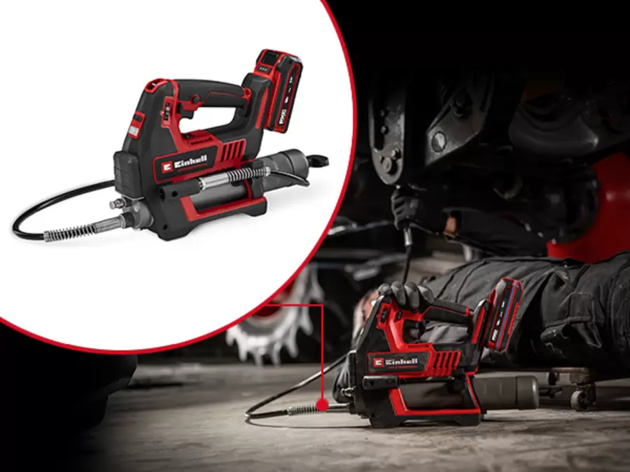 The Einhell cordless grease gun TP-GR 18/690 Li - Solo is used horizontally for maintenance work under a vehicle. The entire grease gun is shown in a circle.