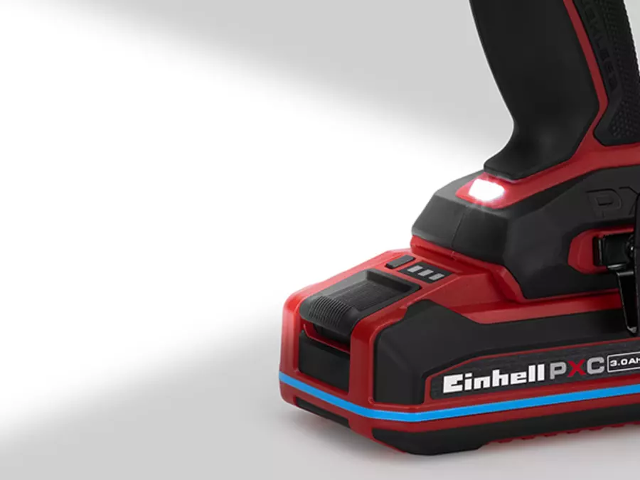 The Einhell TP-CDD 18/70 1-C Li-i +70 (3Ah) cordless impact drill/driver with activated LED light illuminates the work area.