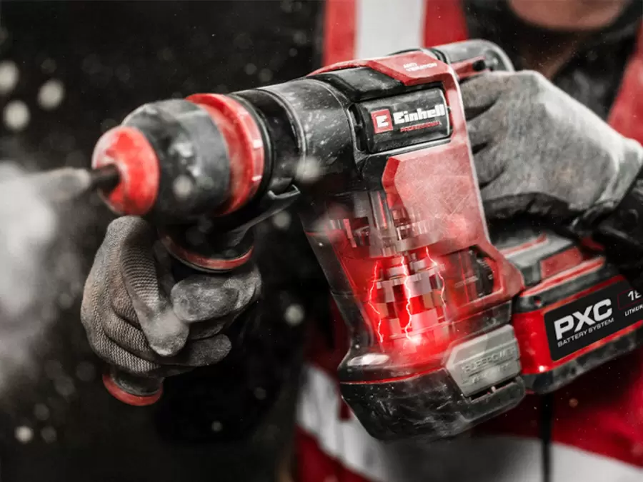 A hand turns the impact rate adjustment dial on the Einhell cordless demolition hammer TP-DH 18/4 Li BL.