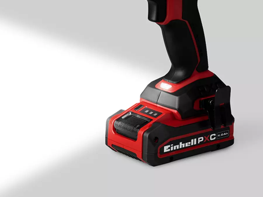 The Einhell Cordless Impact Drill Driver TP-CD 18/70-C Li-i BL - Solo with activated LED light at the base for better illumination.