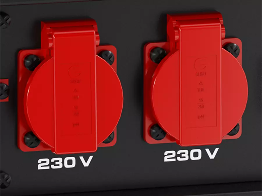Dos enchufes rojos del generador Einhell TC-PG 3100 con tapas, marcados con “230 V”.