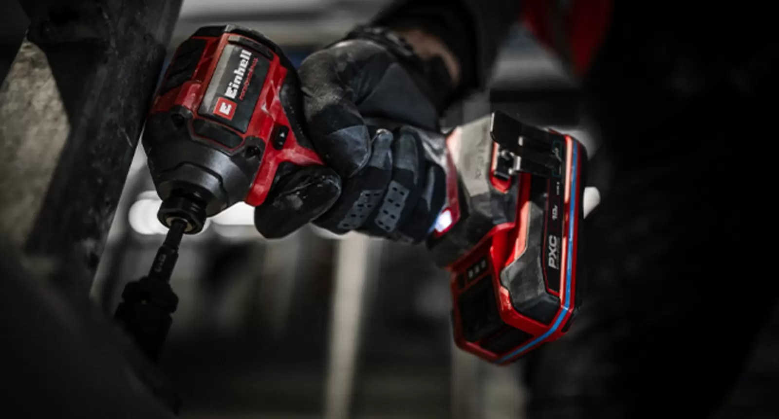 The Einhell Cordless Impact Driver TP-CI 18/250-C Li BL – Solo in use in a dark environment.