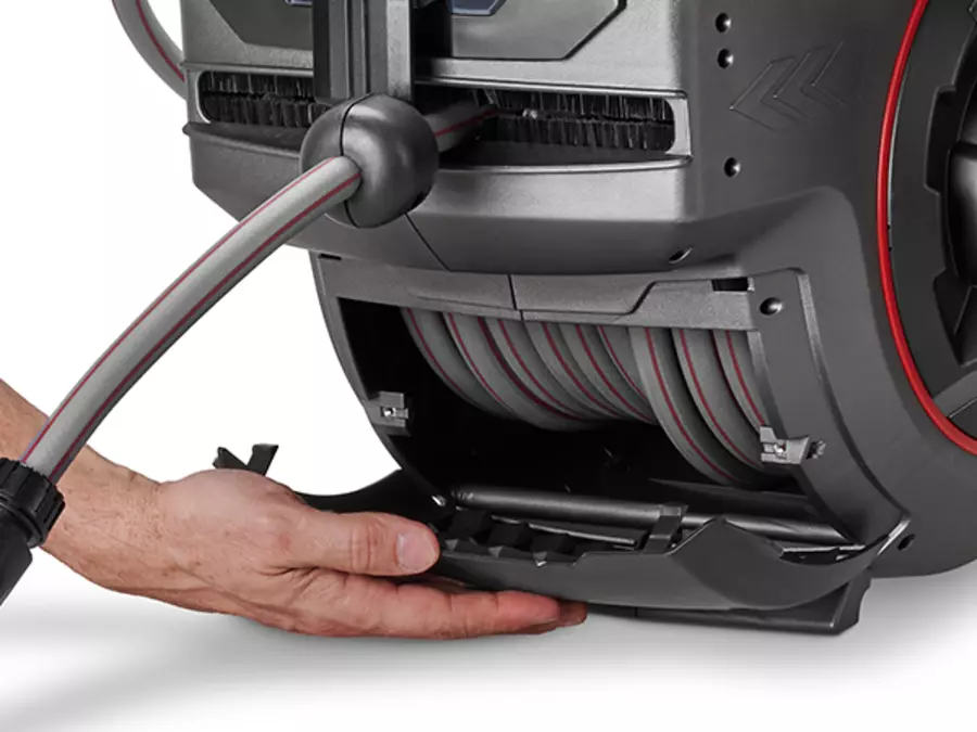 The Einhell cordless hose reel GE-HR 18/30-1 WH Li-Solo with open maintenance flap and visible hose guide.