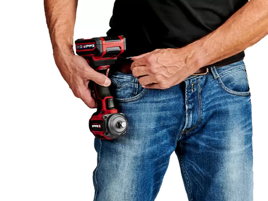 The Einhell cordless impact driver TP-CWD 18/3501-C Li BLis attached to the waistband using the belt clip.