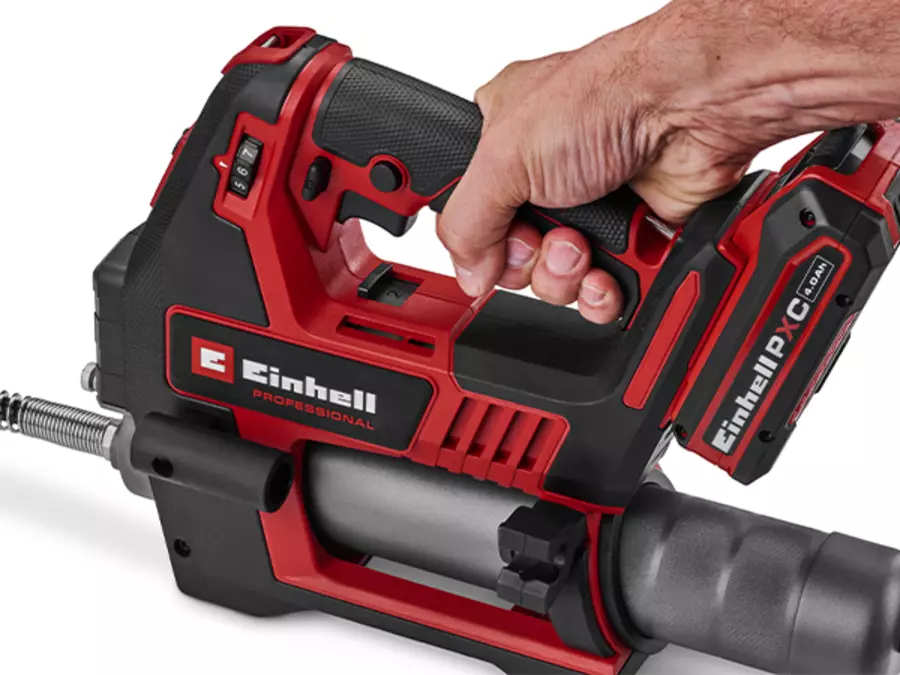 The Einhell cordless grease gun TP-GR 18/690 Li - Solo held by its ergonomically shaped handle with soft grip.