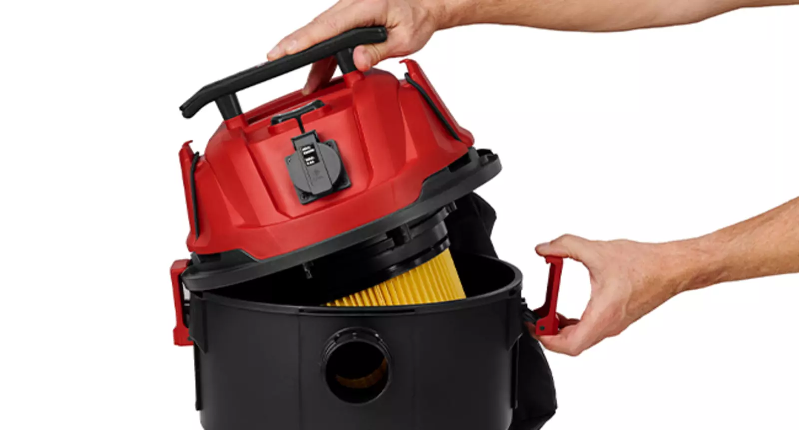 L'aspirapolvere a umido e a secco Einhell TC-VC 2555 A con contenitore in plastica; mani aprono il contenitore tramite chiusure rapide.