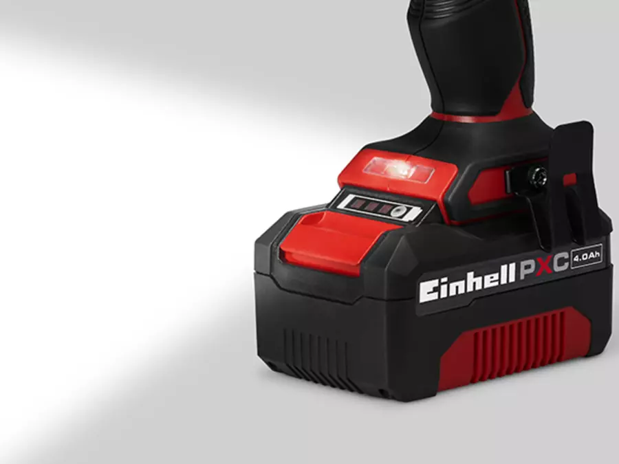 The Einhell TP-CD 18/70 Li-i BL cordless impact drill kit with LED light switched on under the chuck.