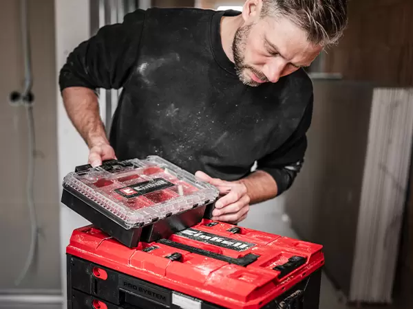 Einhell Pro System Half Size Organiser Case with transparent lid and Modular Boxes visible inside during transport.