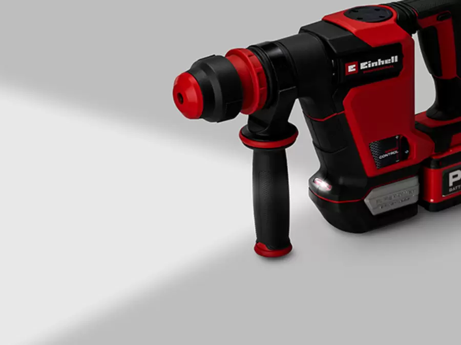 The Einhell cordless demolition hammer TP-DH 18/4 Li BL with a glowing LED work light at the front.