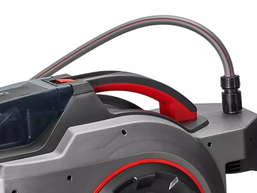 Close-up of the red carrying handle of the Einhell cordless hose reel GE-HR 18/30-1 WH Li-Solo.