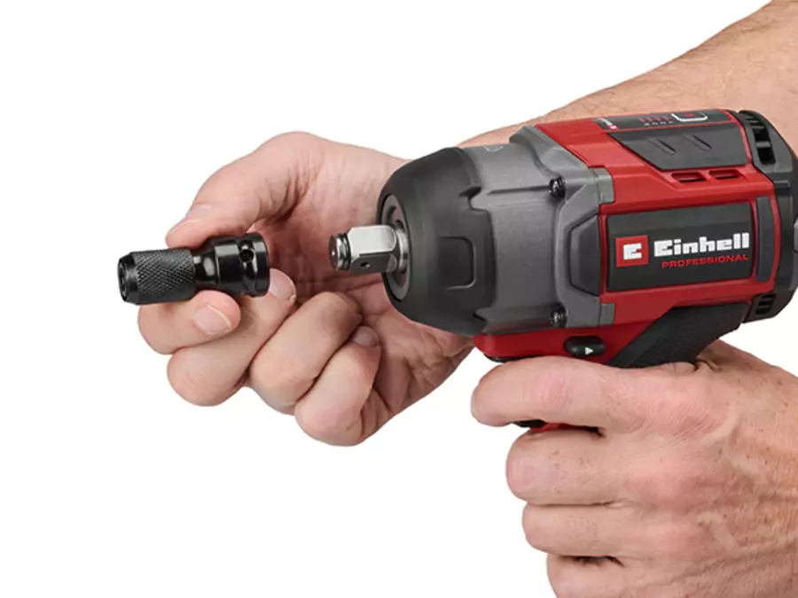 The Einhell cordless impact wrench TP-CW 18/750-C Li BL inserting a hexagon bit adapter.