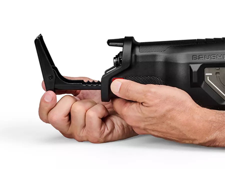 Hand adjusting the shoe of the Einhell cordless universal saw TP-AP 18/32 BL BREAKER Kit.
