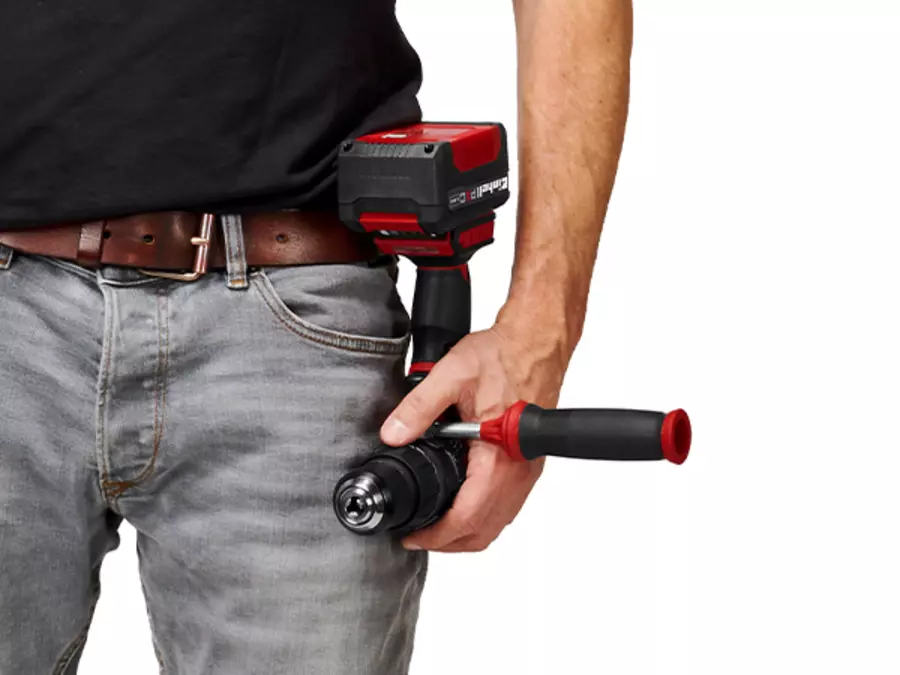 The Einhell TP-CD 18/70 Li-i BL cordless impact drill kit with belt clip attached to a belt.