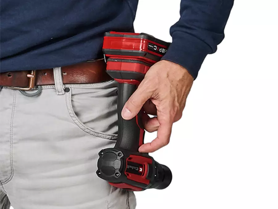 The Einhell cordless drill driver TE-CD 18/50 Li - Solo with belt clip attached to a waistband.