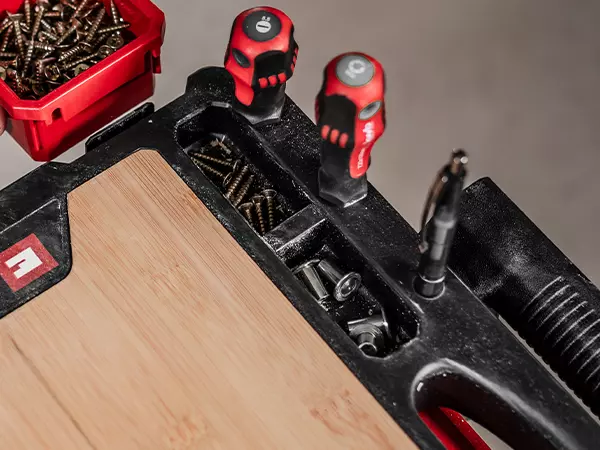 Detailed view of the integrated holders for tools and accessories on the Einhell E-Case worktop.