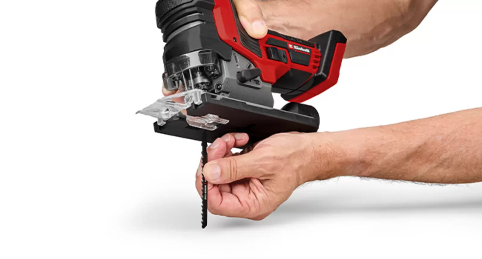 Tool-free blade change on an Einhell Professional cordless jigsaw: a T-shank blade is inserted by hand.