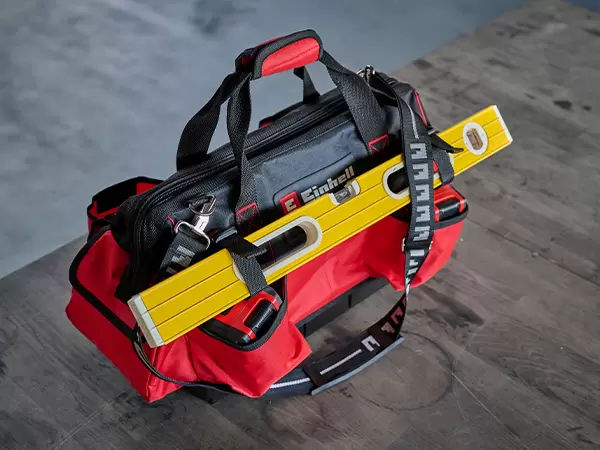 Einhell Pro System Tool Bag loaded with tools including a spirit level, pliers and screwdrivers.