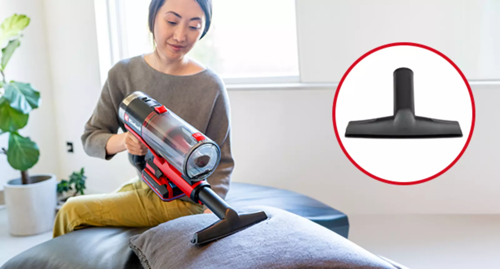 Einhell TE-SV 18 Li-Solo cordless stick vacuum cleaner with the upholstery nozzle fitted, vacuuming a patterned sofa cushion; the flat black upholstery nozzle is shown separately on the right of the picture.
