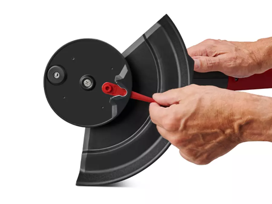 Close-up of the blade holder from below on the Einhell GC-CT 18/2411 Li P cordless trimmer, held by two hands.