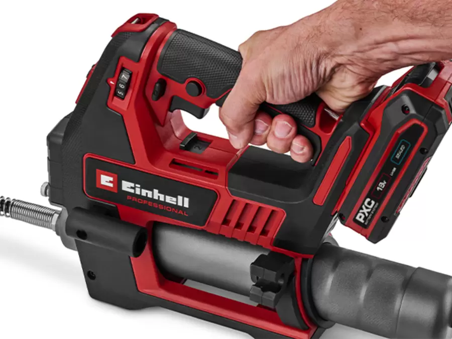 The Einhell cordless grease gun TP-GR 18/690 Li - Solo held by its ergonomically shaped handle with soft grip.