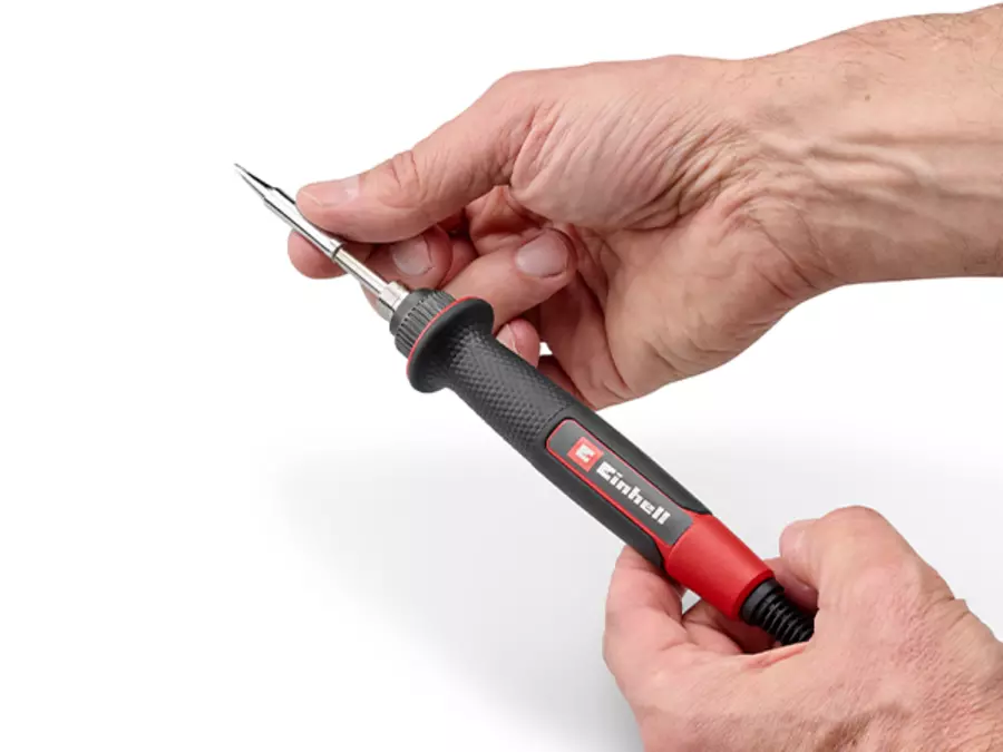 The Einhell cordless soldering iron TE-SI 18/480 Li E - Solo during manual tip replacement.
