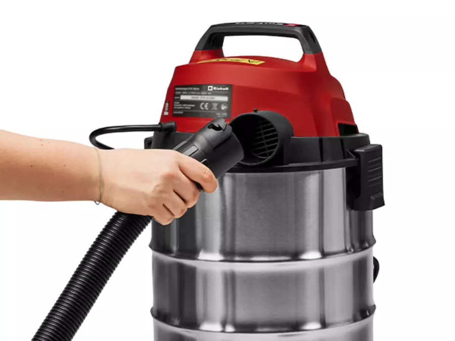 One hand points to the blowing connection on the Einhell wet/dry vacuum cleaner TC-VC 3055 SA.