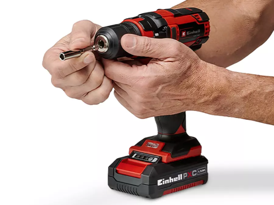 A bit adapter is being inserted into the chuck of the Einhell cordless drill driver TC-CD 18/35 Li.