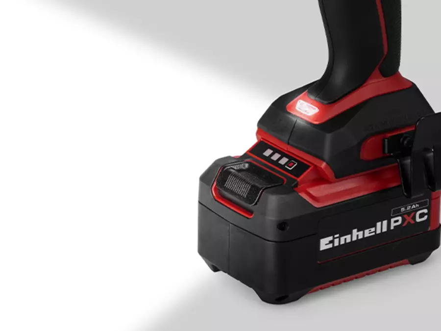 The Einhell cordless impact wrench TP-CW 18/750-C Li BL with LED light turned on at the bottom of the device.