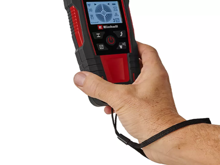 The Einhell digital detector TE-MD 80 is held with one hand, and the easy-to-read display is visible.