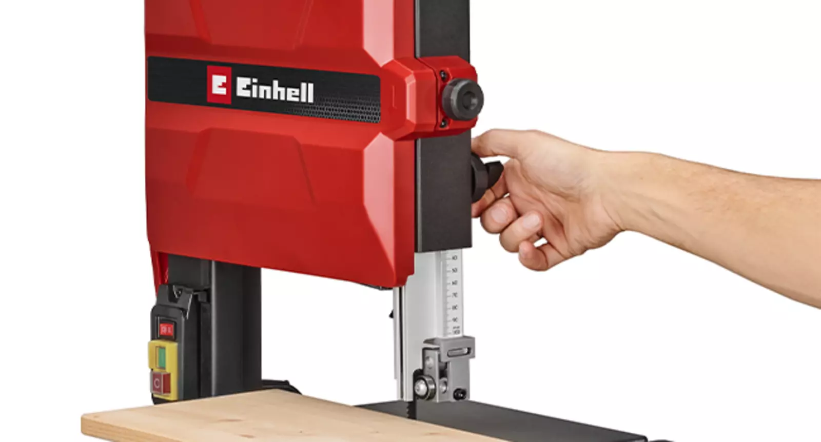 The cutting height of the Einhell TC-SB 245/1 L band saw is being adjusted with one hand and without tools.