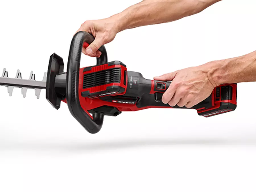 The rotating handle of the Einhell cordless hedge trimmer GP-CH 36/65 Li BL-Solo is shown during horizontal cutting.