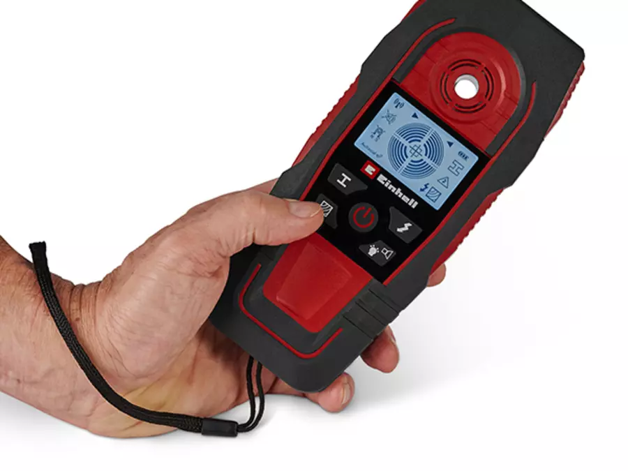 The Einhell digital detector TE-MD 80 is held on the hand strap, and the display shows measurement results.