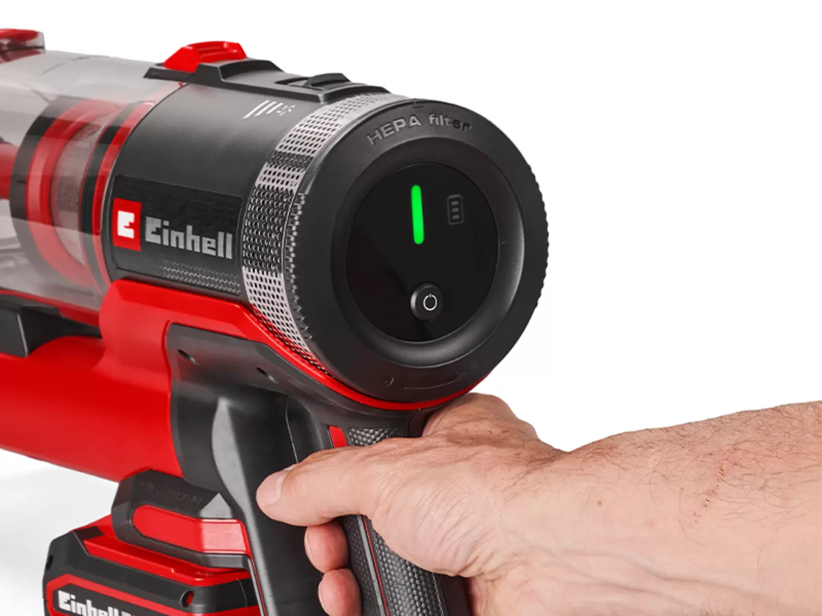 Close-up of the Einhell cordless stick vacuum cleaner TE-SV 18/270/1 Li BL-Solo with a hand on the handle; the LED display shows a green indicator and a battery symbol.