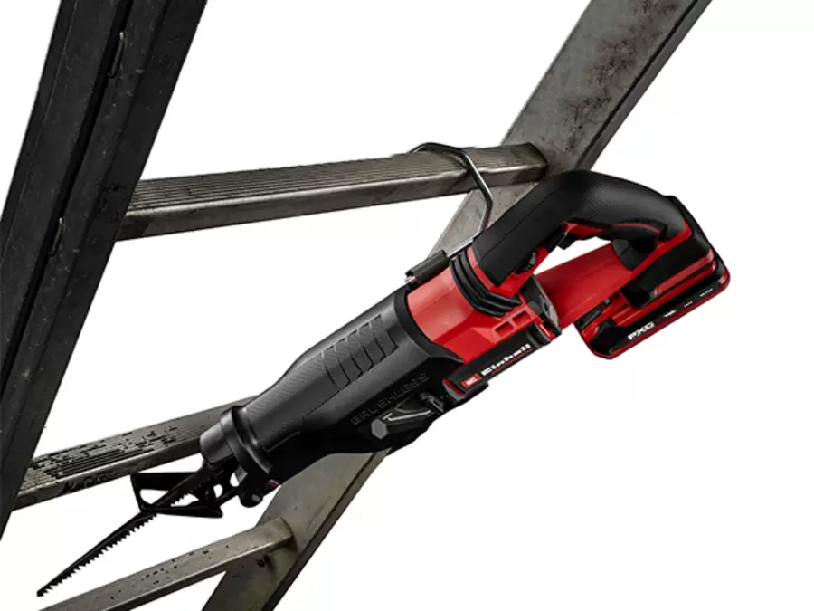 The Einhell cordless universal saw TP-AP 18/32 Li BL - Solo hangs securely on a metal frame using the integrated scaffolding hook.