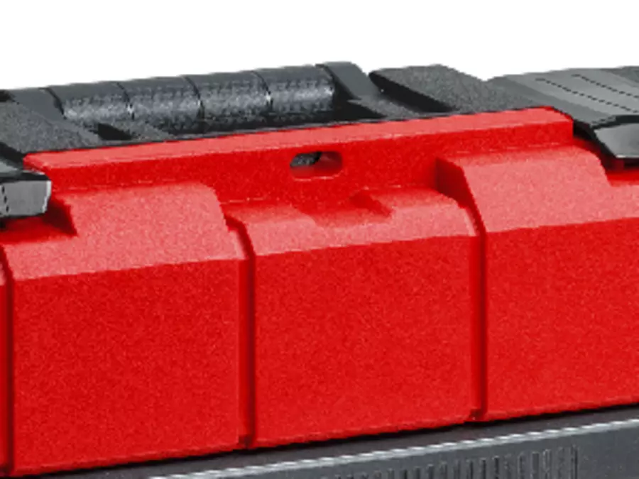 Close-up of red Einhell tool case with hole in the lid for padlock.