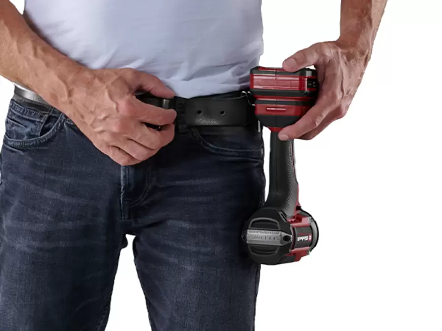 The Einhell cordless impact wrench TP-CWD 18/7501-C Li BL +6 S-F is worn on a belt clip on the waistband.