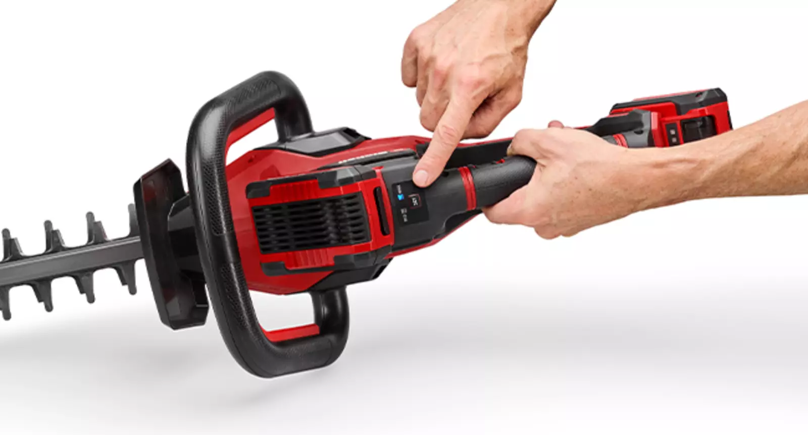 A hand adjusts the speed on the Einhell cordless hedge trimmer GP-CH 36/65 Li BL-Solo using the control dial.